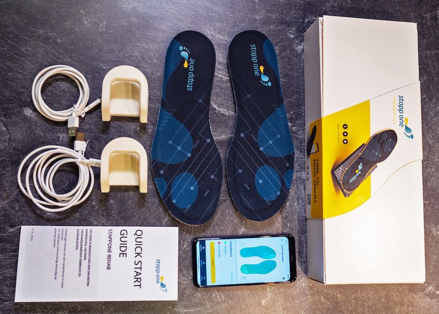 Contents of the STAPPONE Rehab product package, sensor soles, chargers and cables, app, quick start guide.